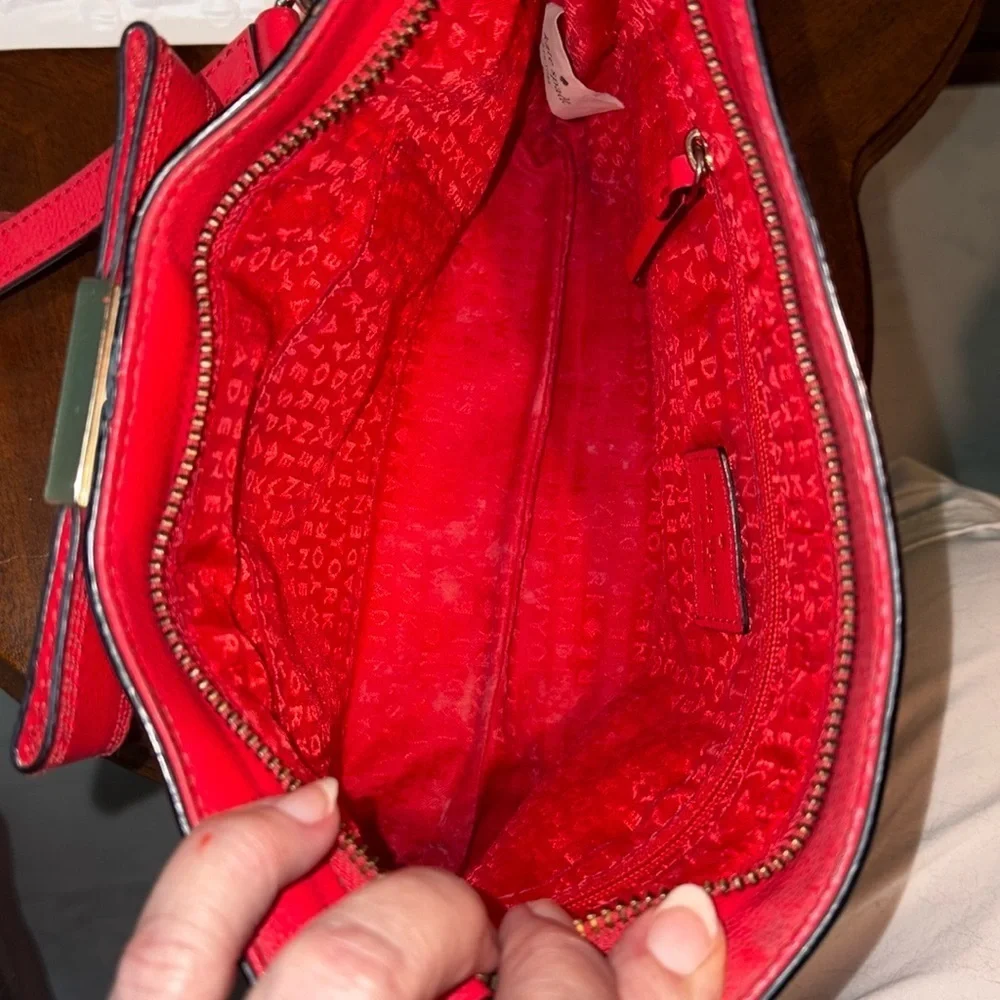 Kate Spade   Crossbody bag  leather orangeish red   bow on front chain strap det